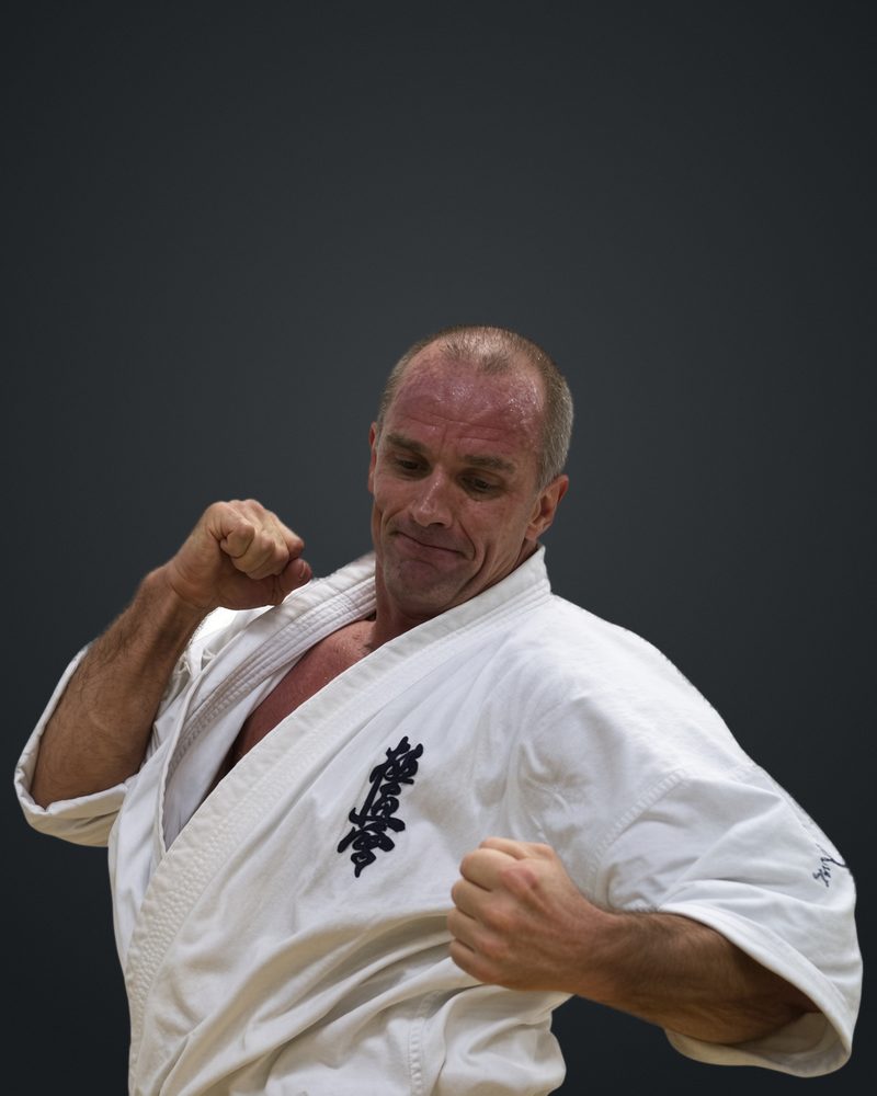 Judd Reid in his Kyokushin gi, throwing a punch